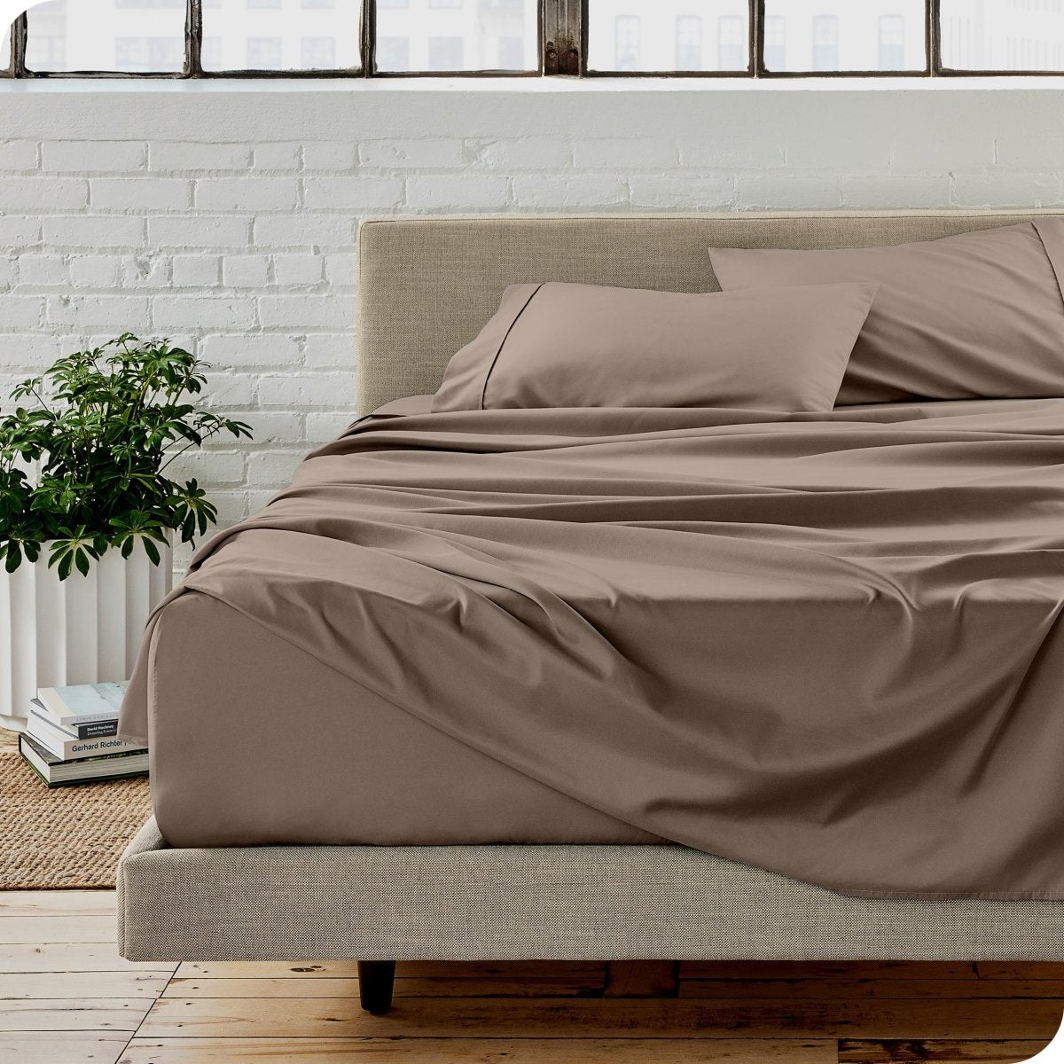 A modern bedroom with microfiber sheets on the mattress