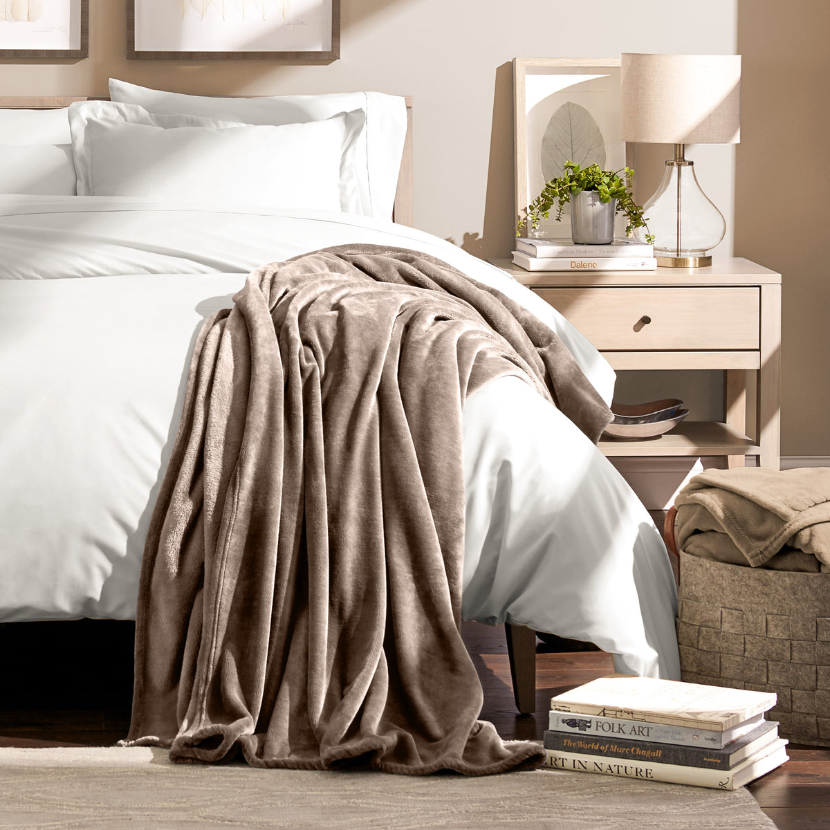 Microplush blanket draped over the corner of a bed