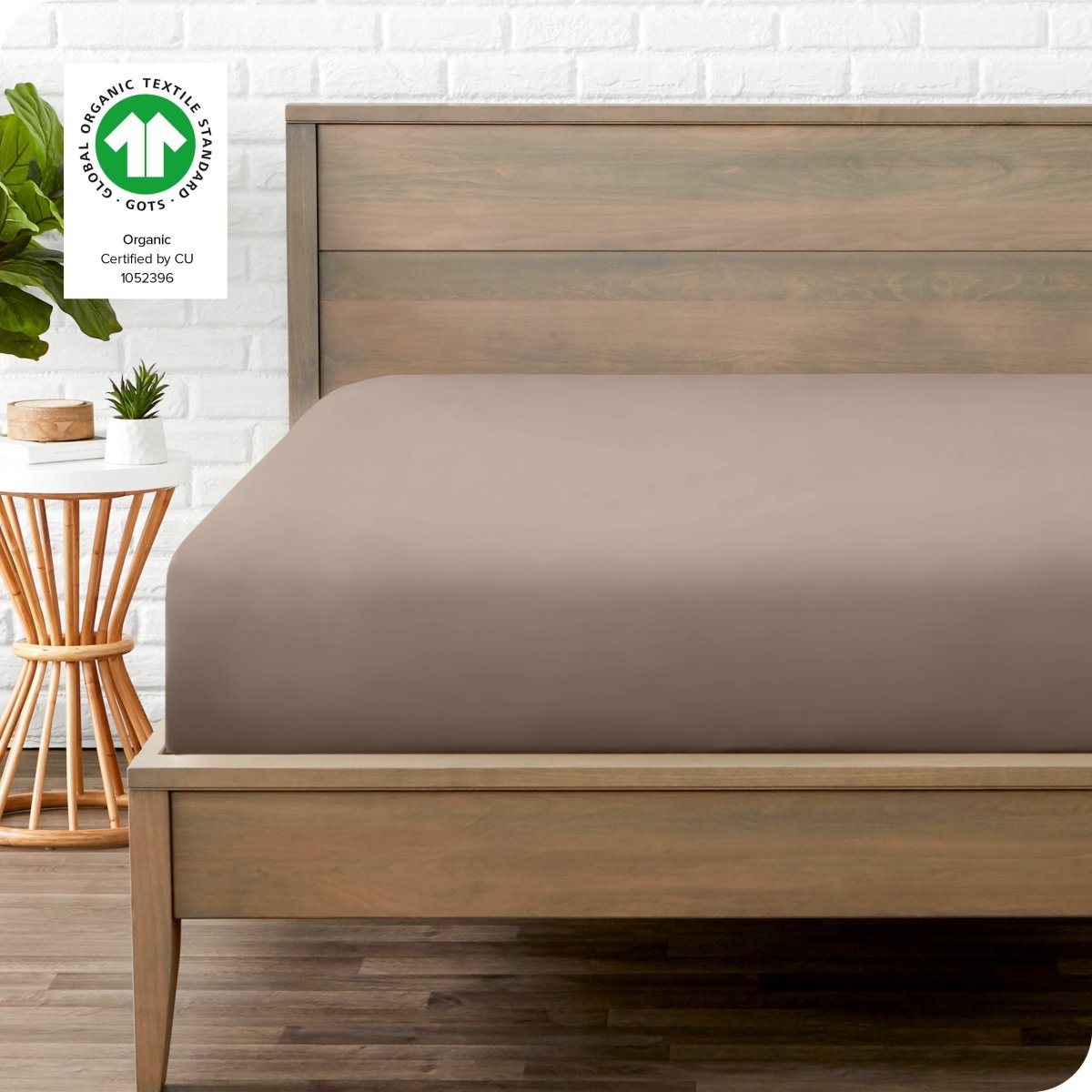 Modern wood bed frame with a sateen fitted sheet on the mattress