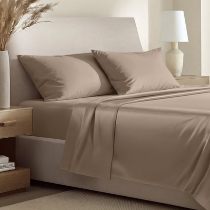 Sateen bedding set including a fitted sheet and two matching pillowcases on a bed.