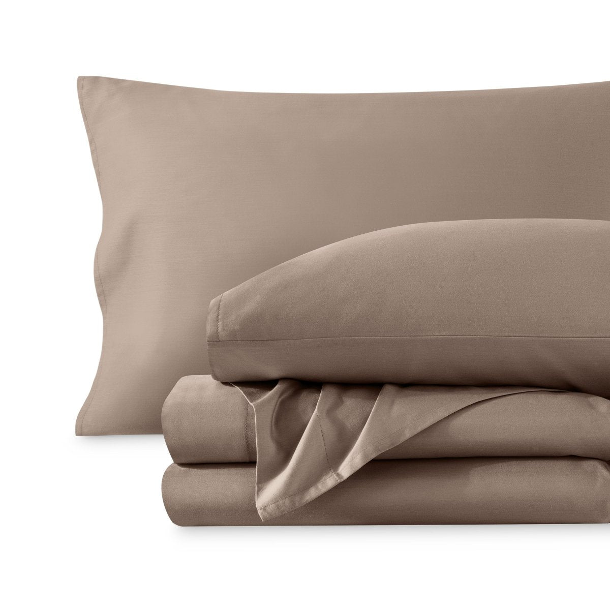 A sateen sheet set folded and stacked on a white background.