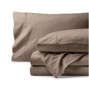 Organic flannel bed sheets and pillowcase set on a white background