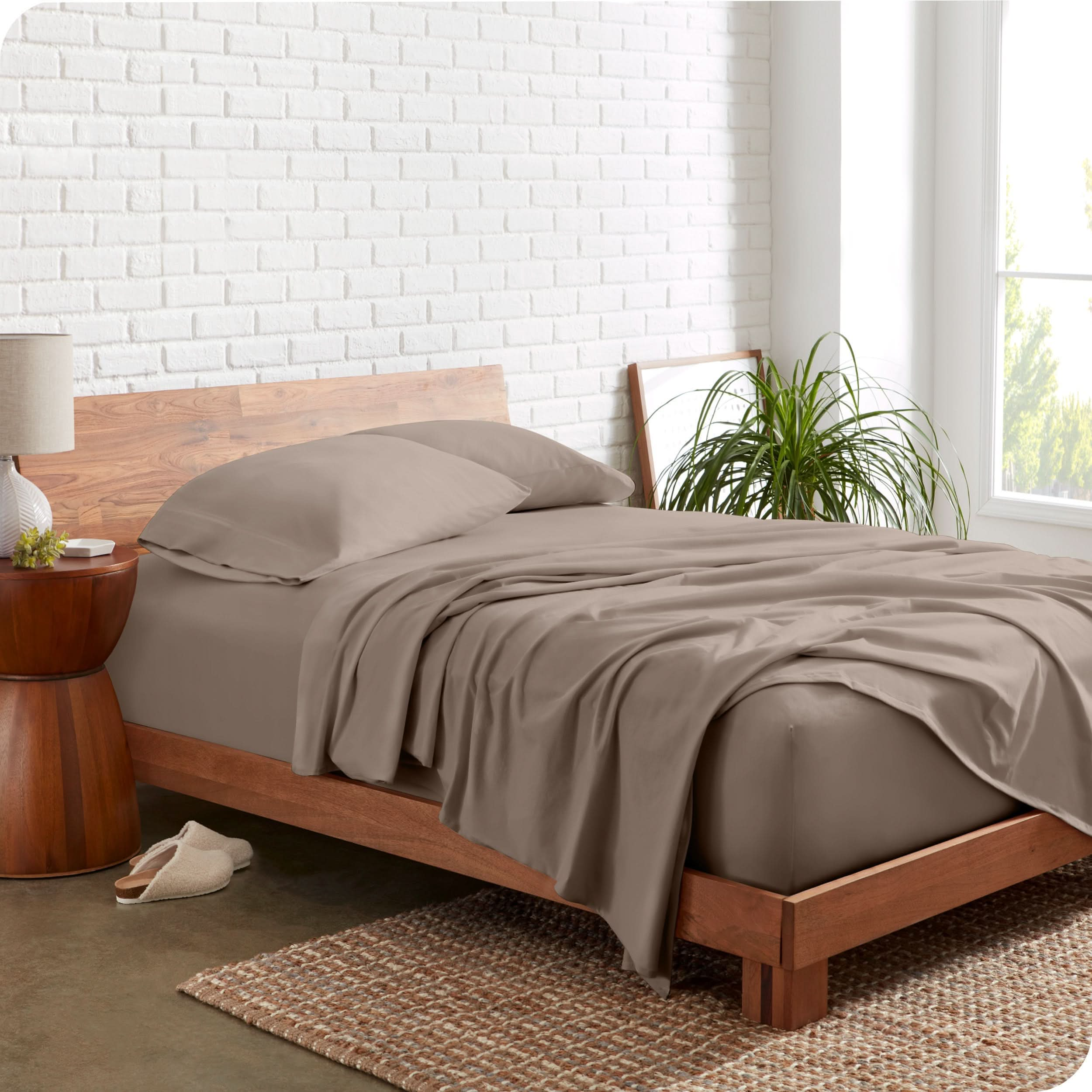 The side view of a bed made with organic cotton jersey sheets