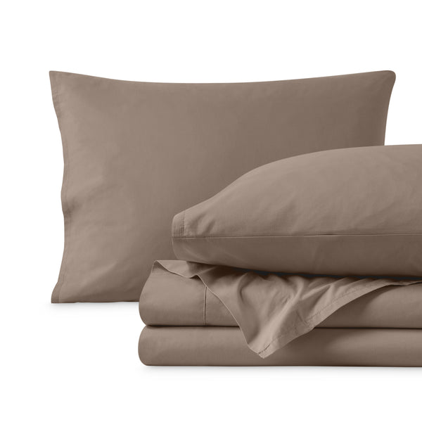 Percale sheets folded and matching pillowcases with pillows in them