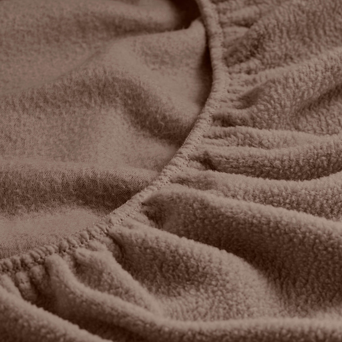 Close-up of a fitted sheet with all around elastic