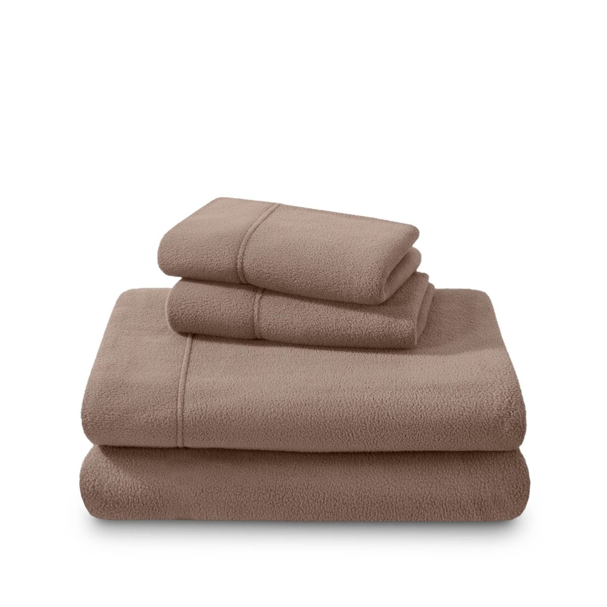 Polar fleece sheets and pillowcases folded and stacked on a white background