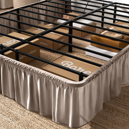 Bed frame with bed skirt and Bare Home boxes underneath.