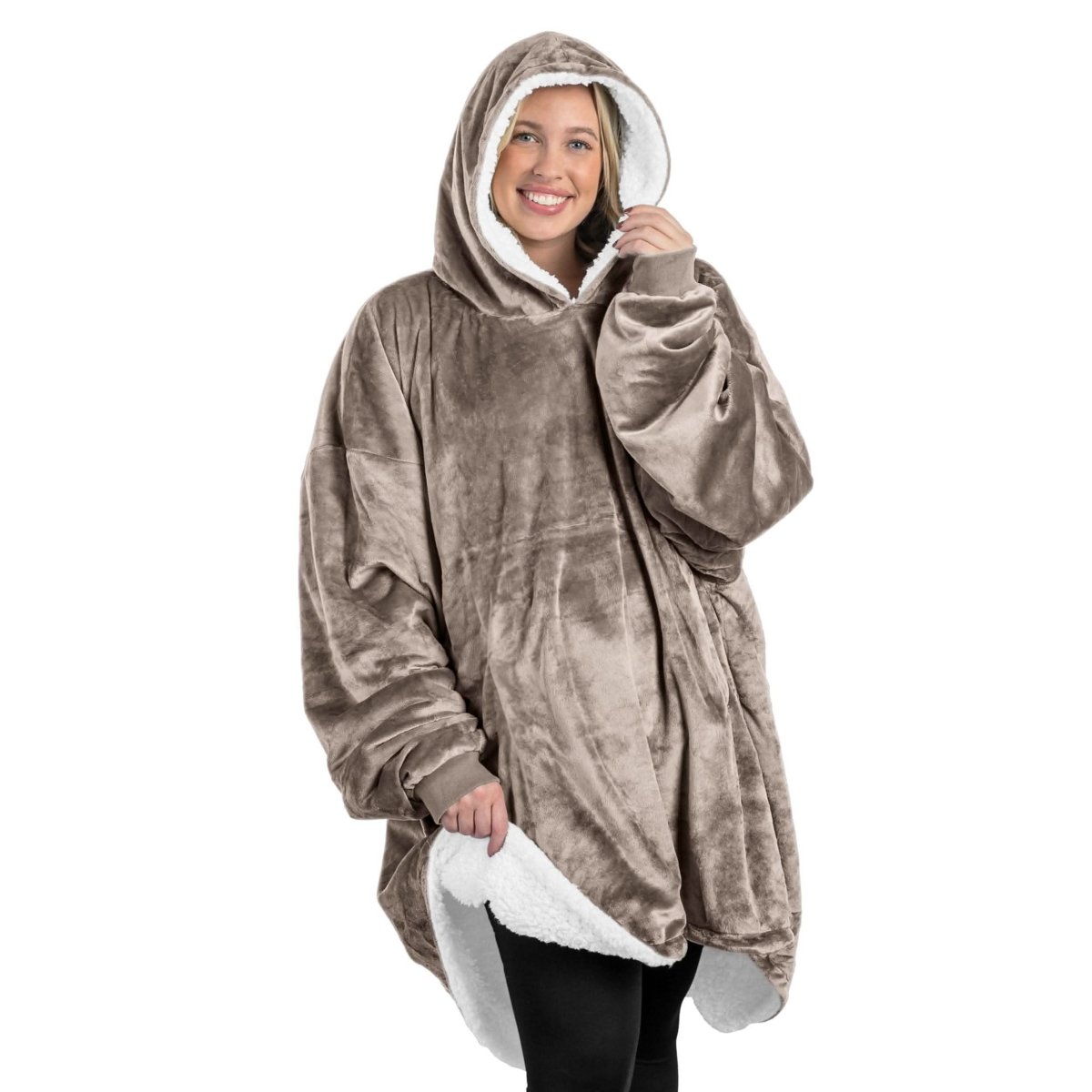 An adult with a sherpa wearable blanket on