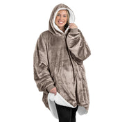 An adult with a sherpa wearable blanket on