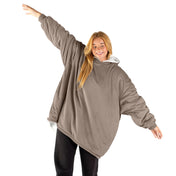 A woman with a wearable blanket on