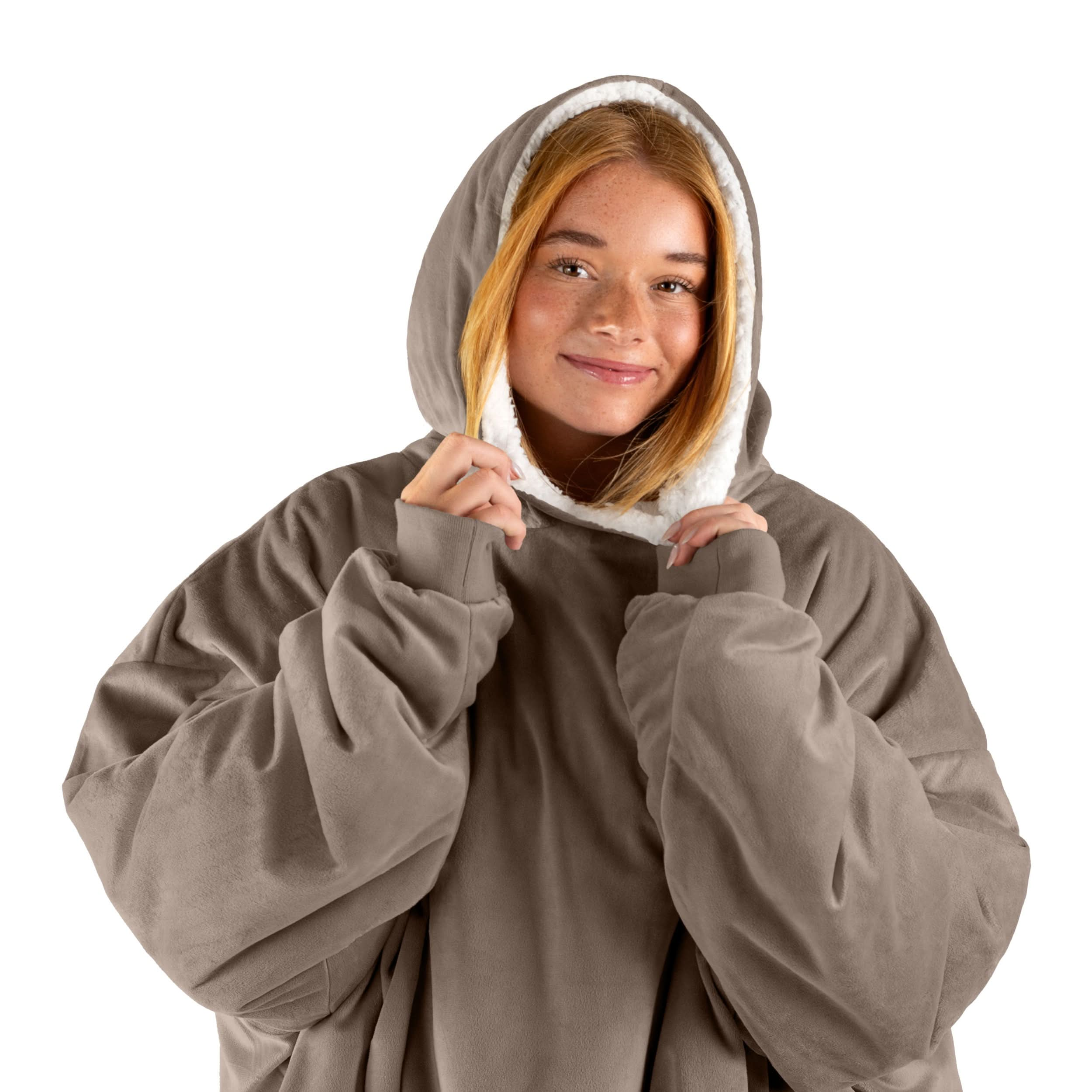 A woman with a wearable blanket on