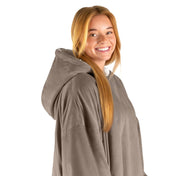 An adult with a hooded wearable blanket on
