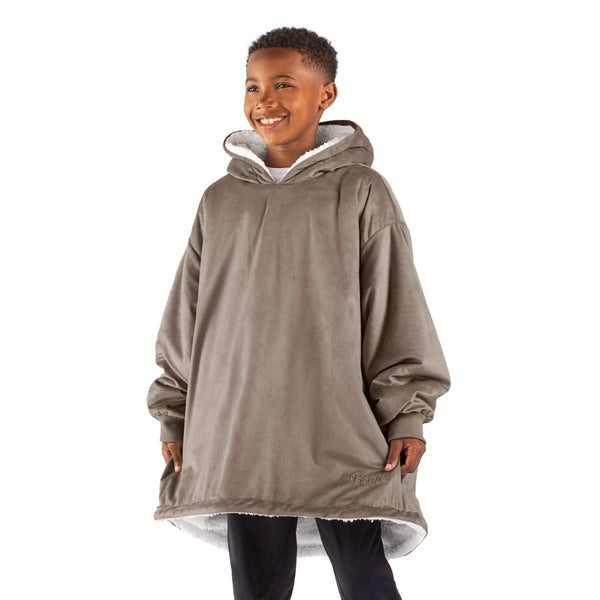 A child with a sherpa wearable blanket on
