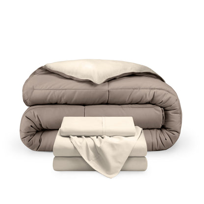 A reversible microfiber comforter and a coordinating sheet set folded and stacked