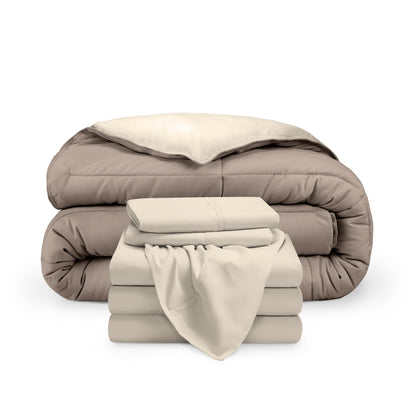 A reversible microfiber comforter and a coordinating sheet set folded and stacked