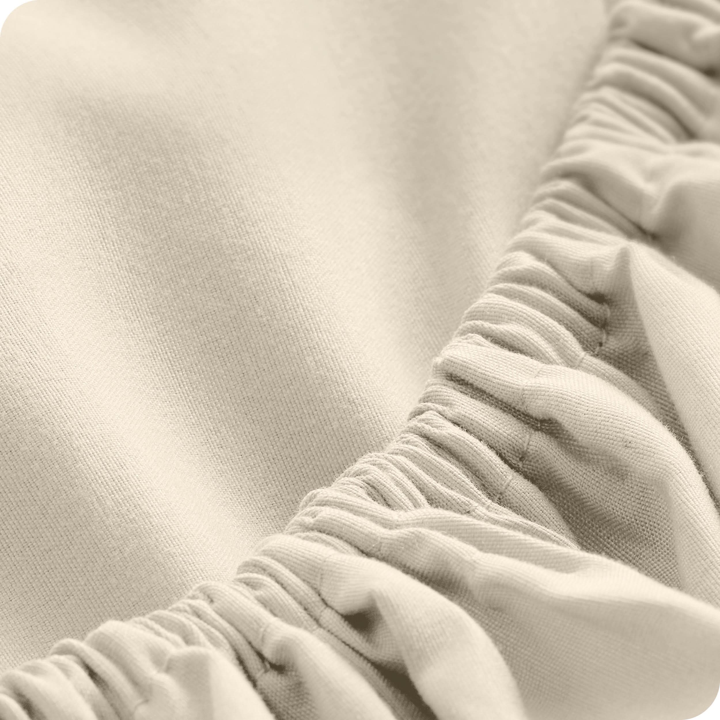 Close up of a fitted sheet with all around elastic