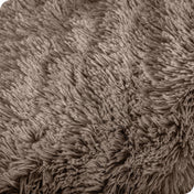Close up of the soft texture of a shaggy faux fur sherpa blanket