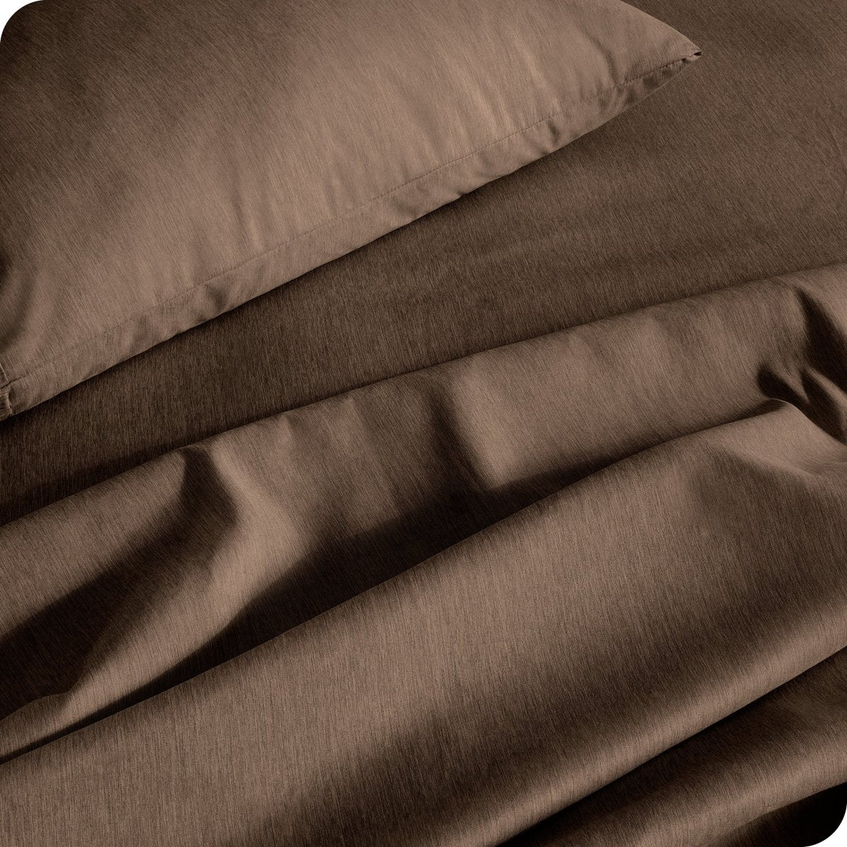Close up of a heather sheet set on a bed