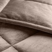 Close-up of a weighted blanket showing the stitching and texture