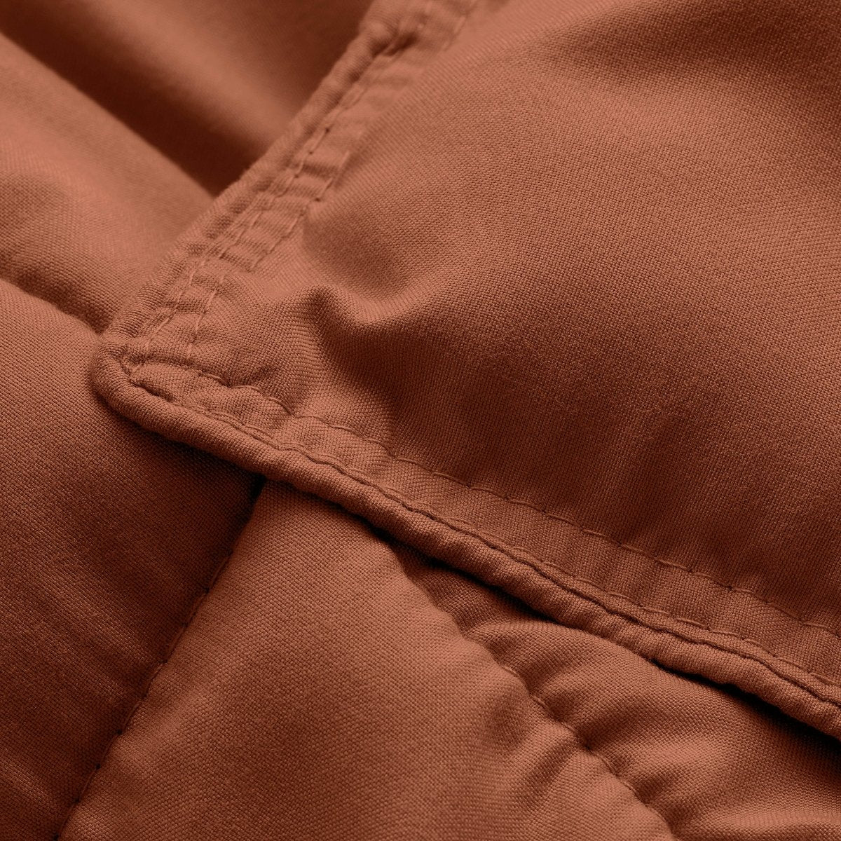 Close-up of comforter fabric with stitching detail