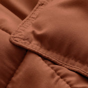 Close-up of comforter fabric with stitching detail