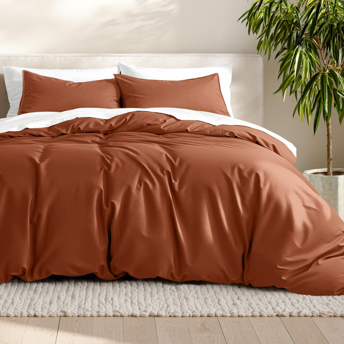 Microfiber bedding set on a bed with a neutral background