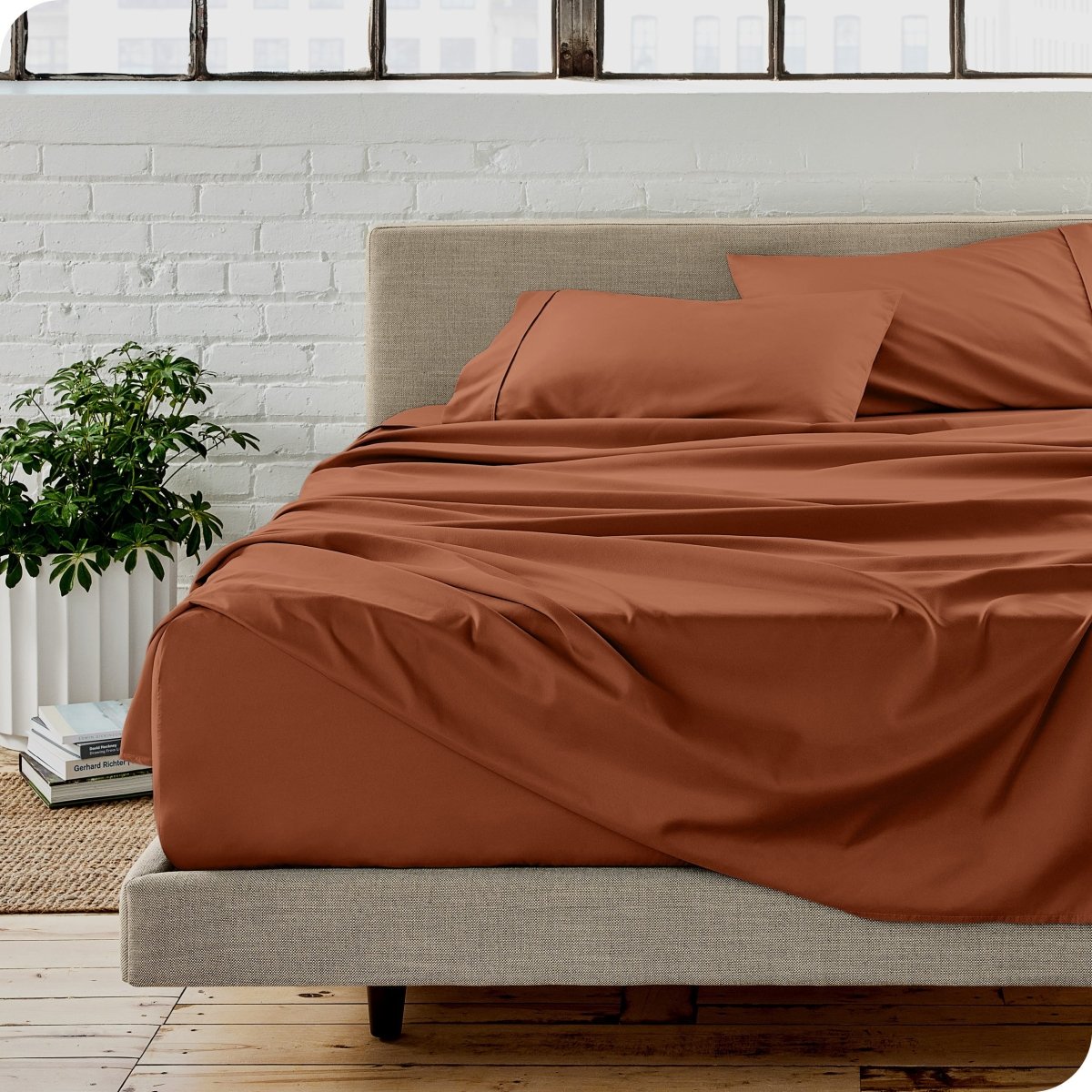 A modern bedroom with microfiber sheets on the mattress