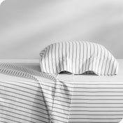 A printed sheet set on a bed