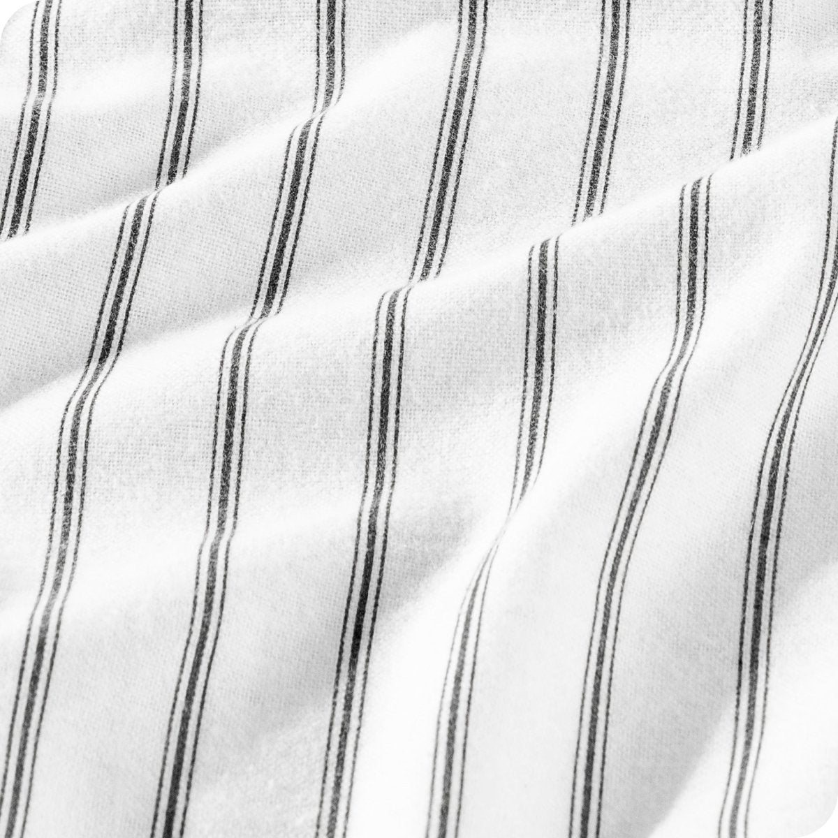 White fabric with thin vertical black pinstripes, shown in soft folds.