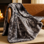 Blanket draped over a chair in front of a fireplace