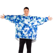 An adult with a sherpa wearable blanket on