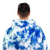 An adult with a hooded wearable blanket on
