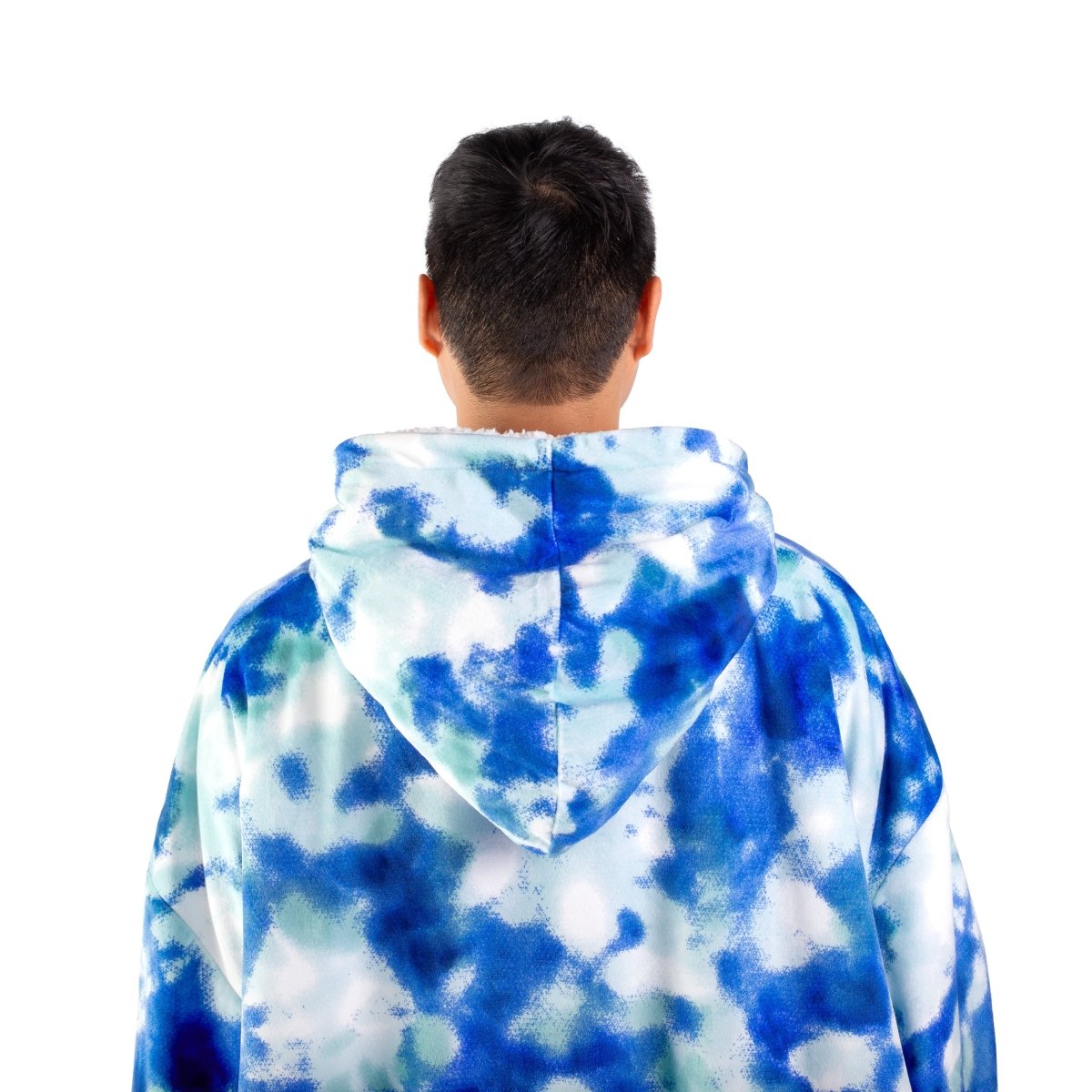 Person wearing a hooded blanket on a white background