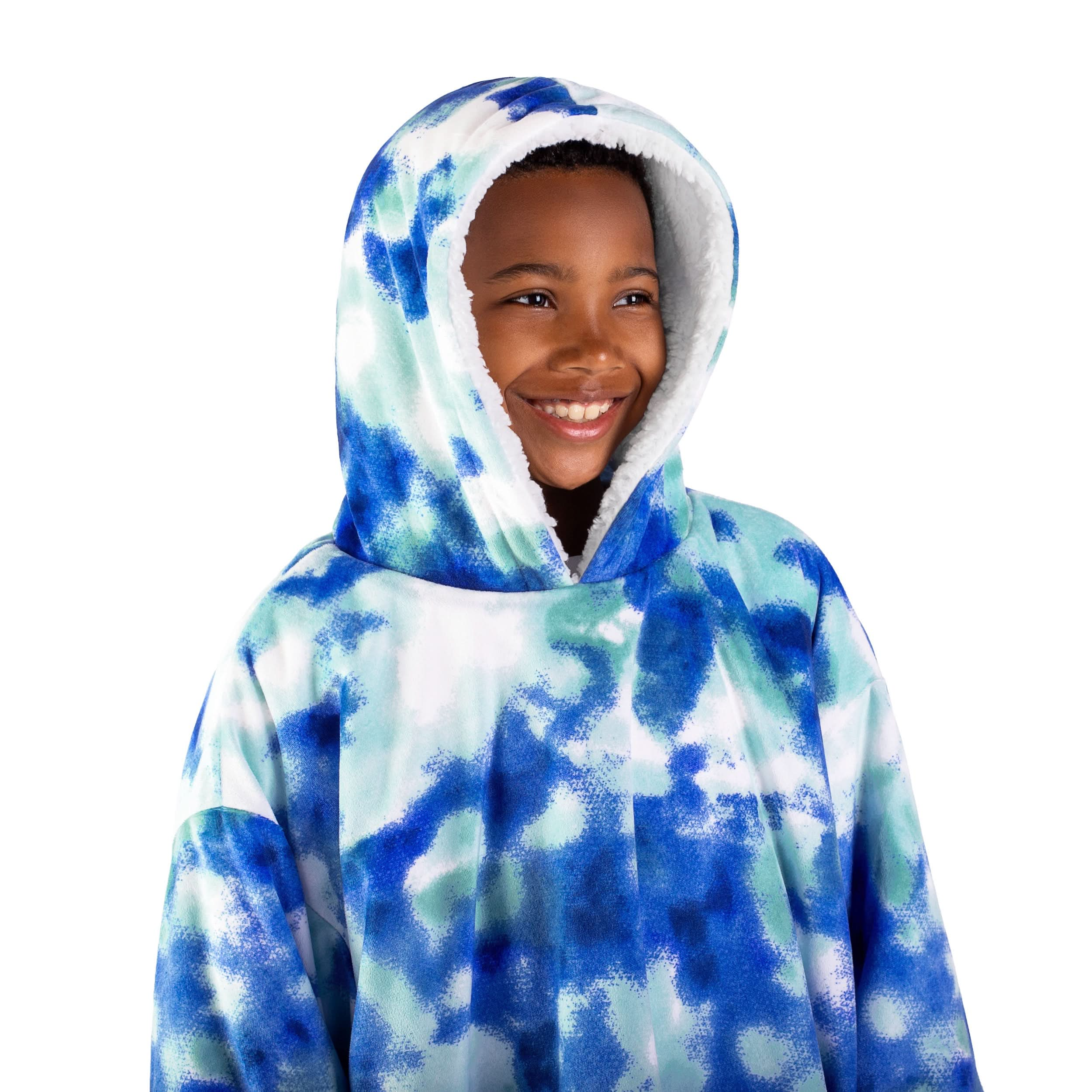 A boy has a wearable blanket on