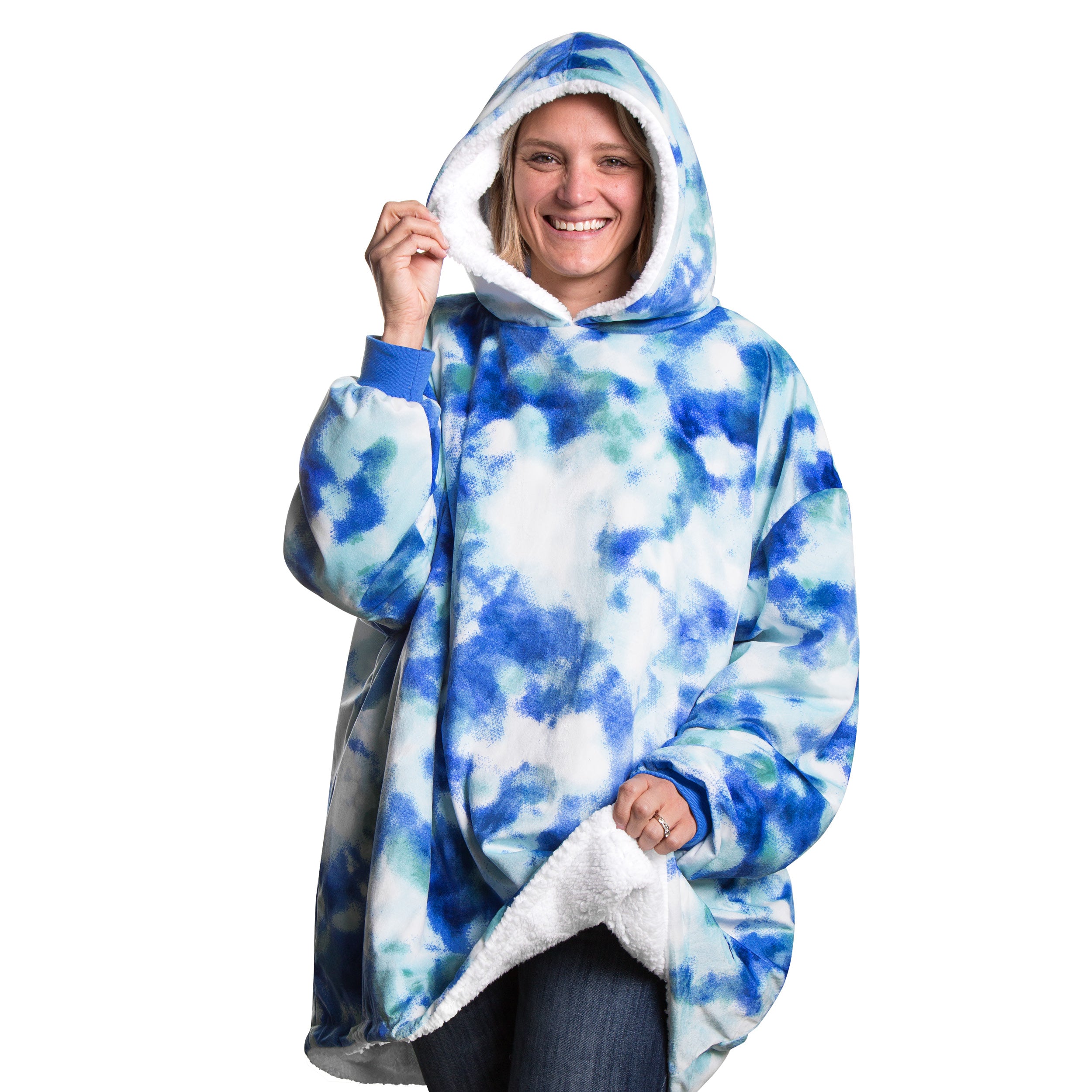 A oversized printed sherpa wearable blanket with a hood on a woman.