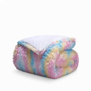 A modern bedroom with a shaggy duvet cover on the bed.