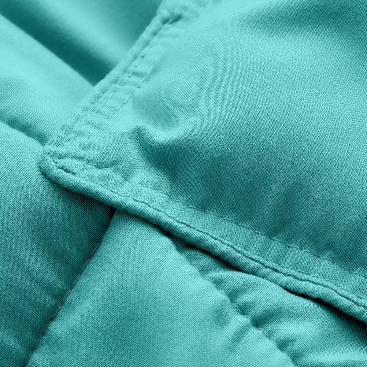 Close-up of comforter fabric with stitching detail