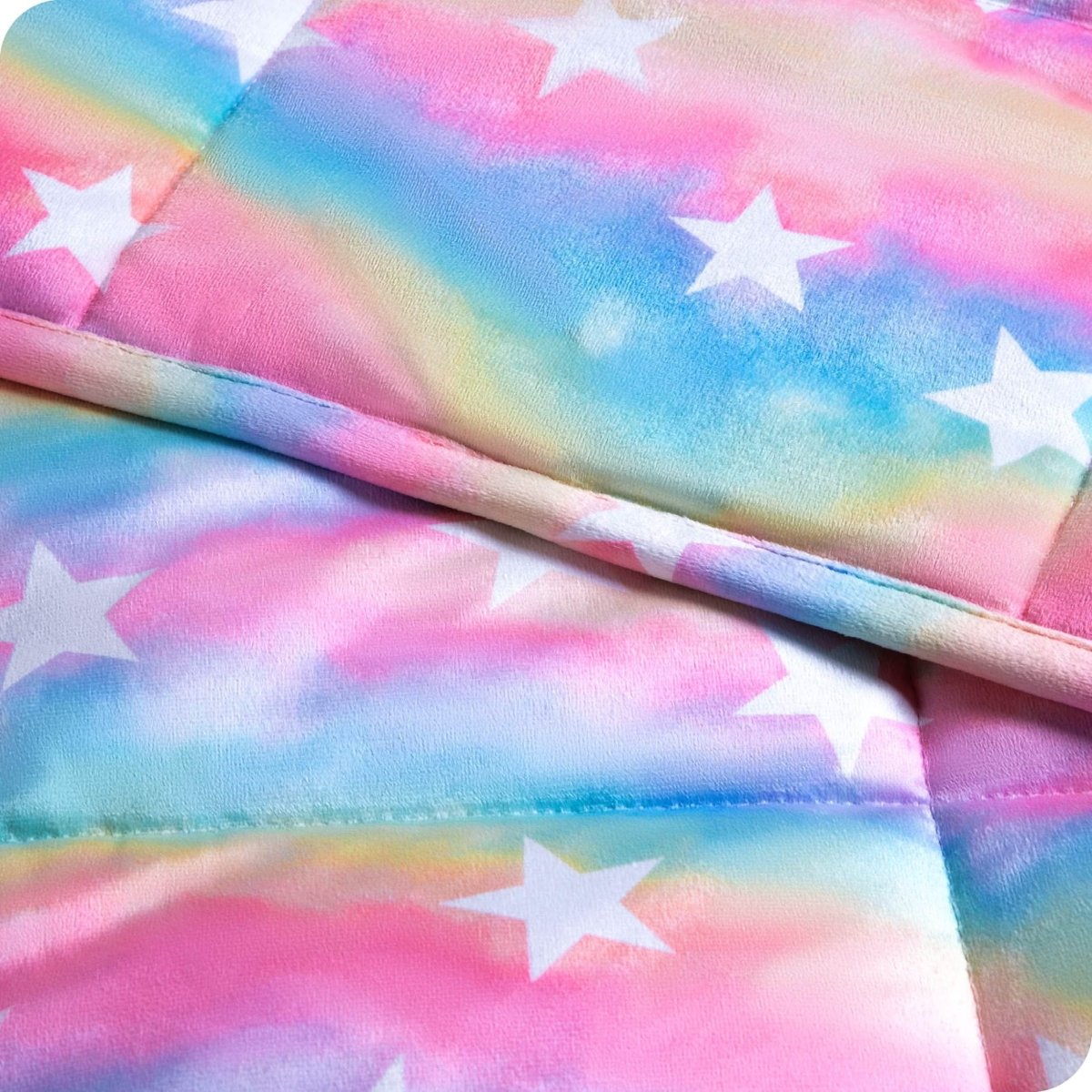 Close-up image of a weighted blanket, featuring detailed stitching and the neatly finished edge of the blanket.