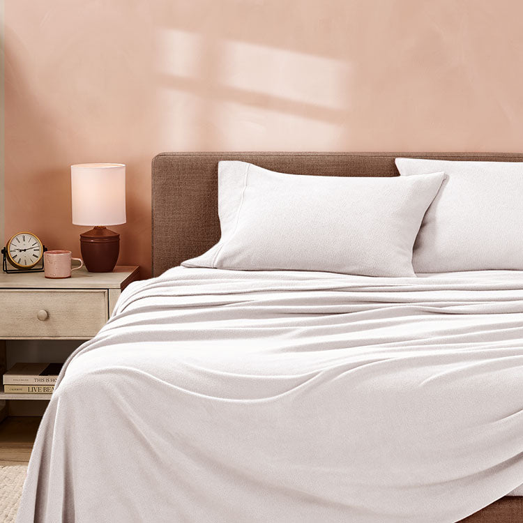 White sheets in a cream room with sunlight