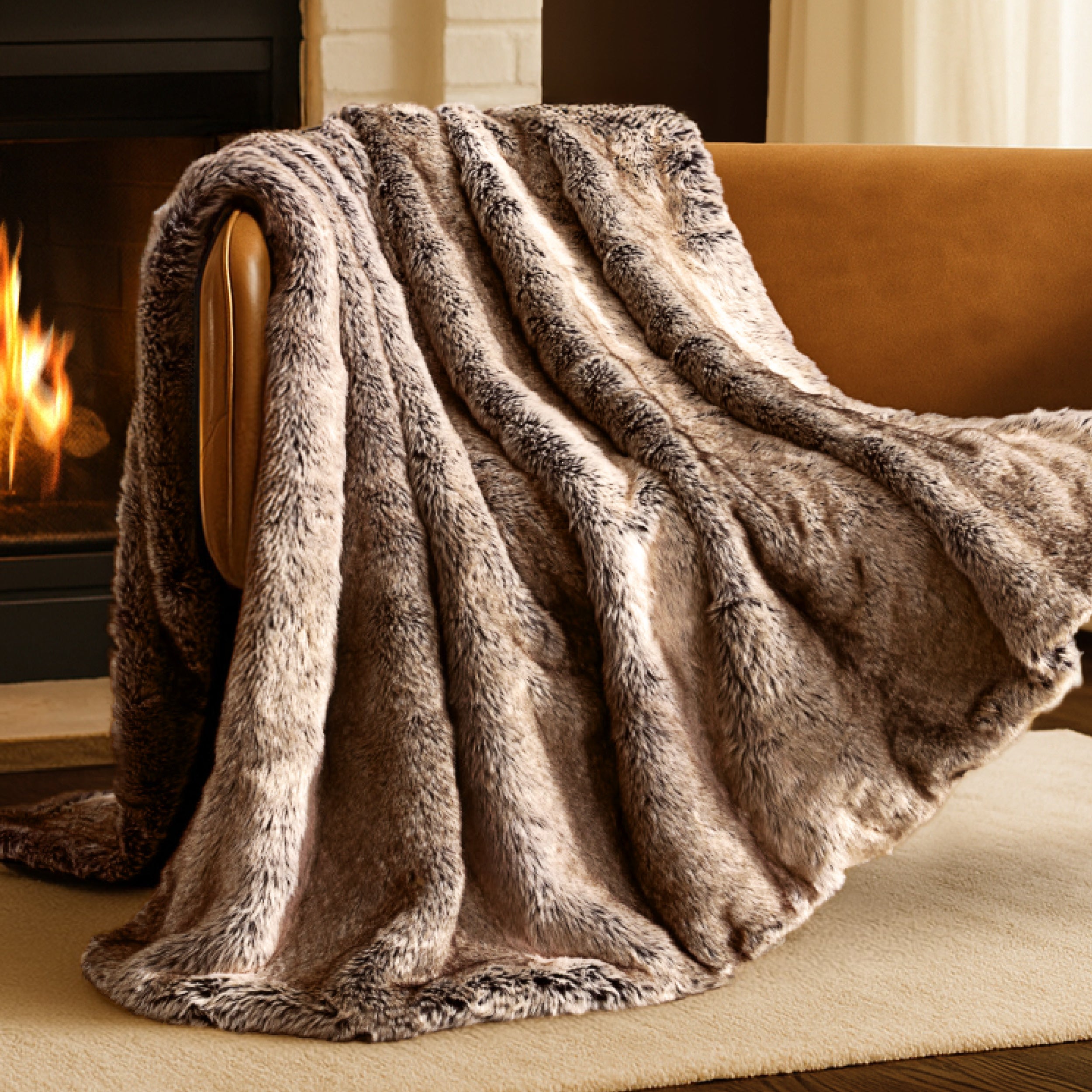 Blanket draped over a chair in front of a fireplace