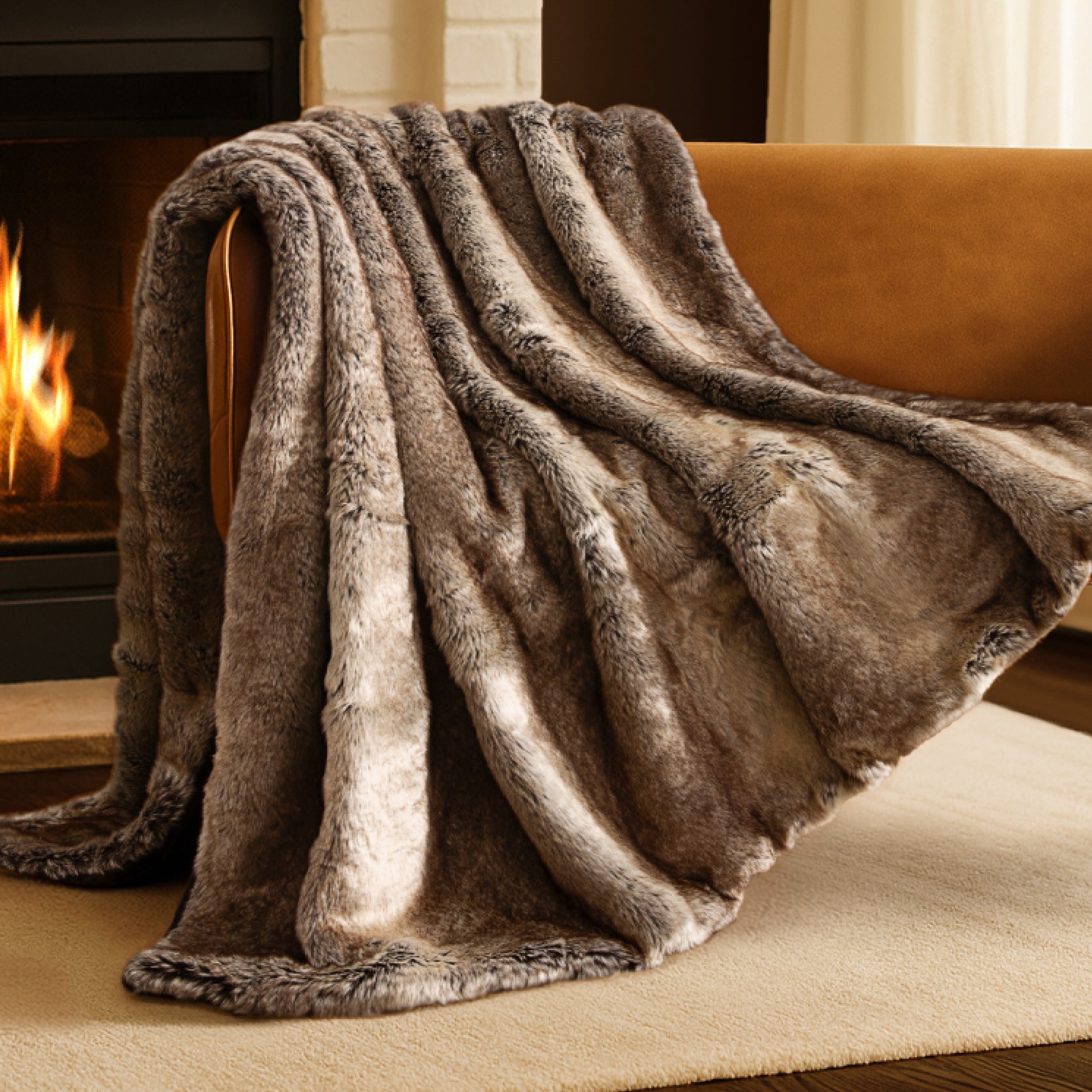 Blanket draped over a chair in front of a fireplace