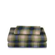 Stack of flannel sheets and pillowcases on a white background