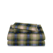 Stack of flannel sheets and pillowcases on a white background