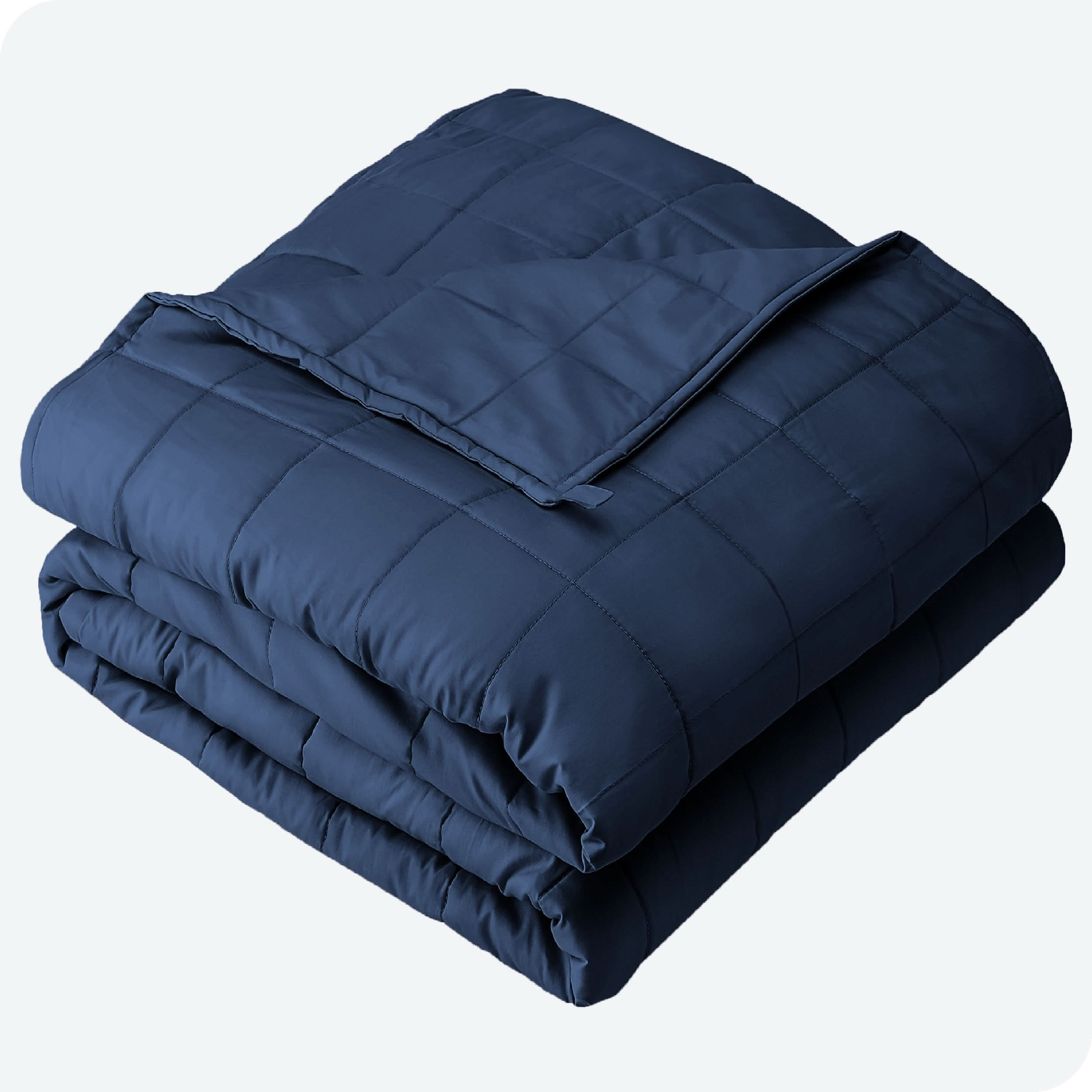 A folded cotton weighted blanket with a white background.