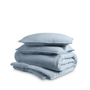 Washed duvet cover and sham set folded and stacked on a white background