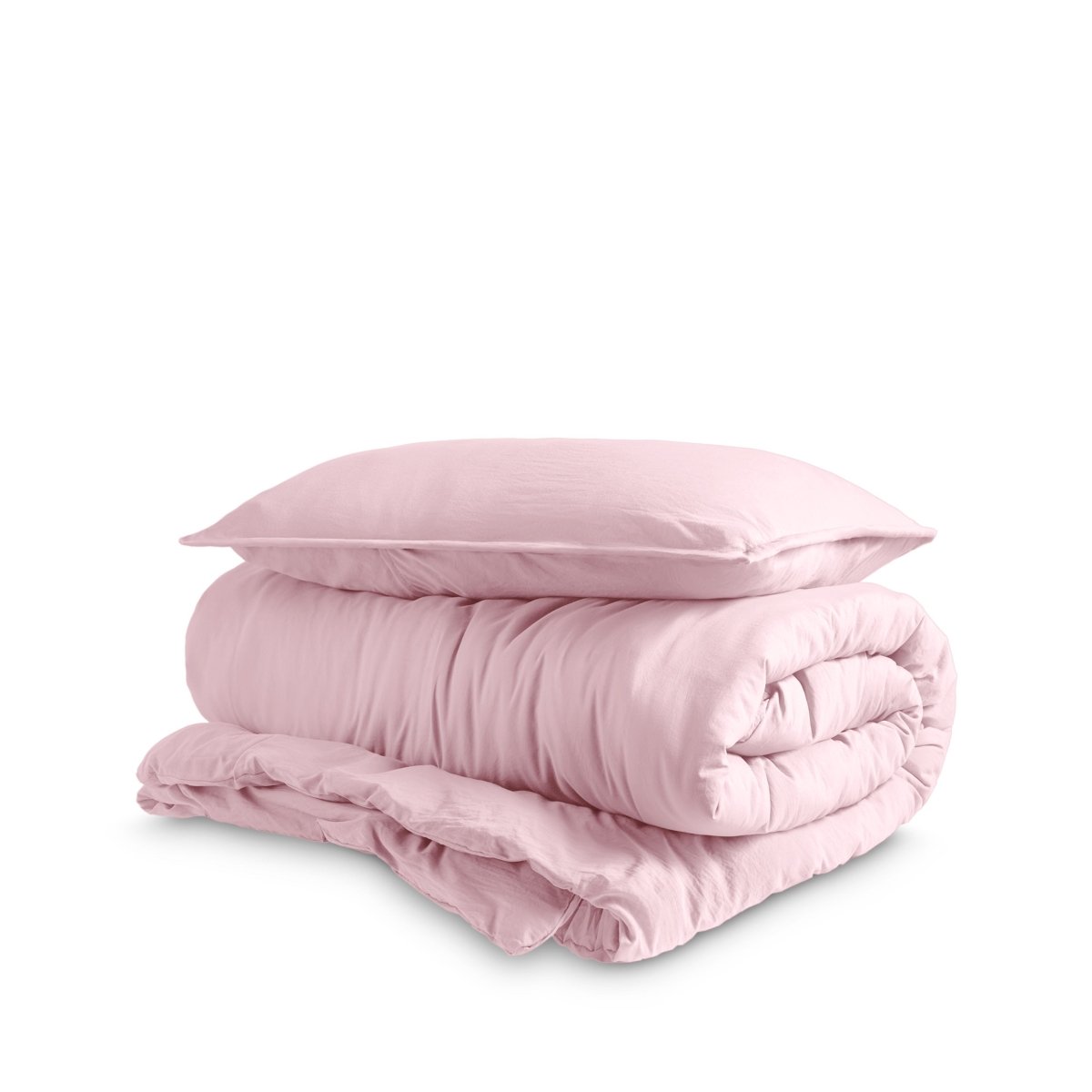 Washed duvet cover and sham set folded and stacked on a white background
