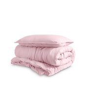 Washed duvet cover and sham set folded and stacked on a white background