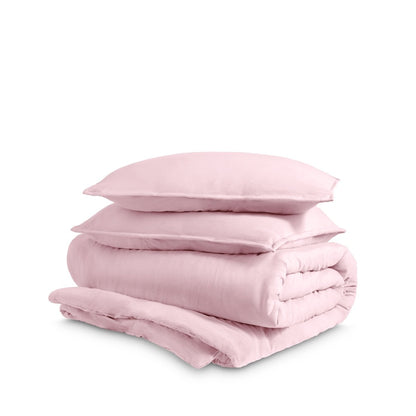 Washed duvet cover and sham set folded and stacked on a white background