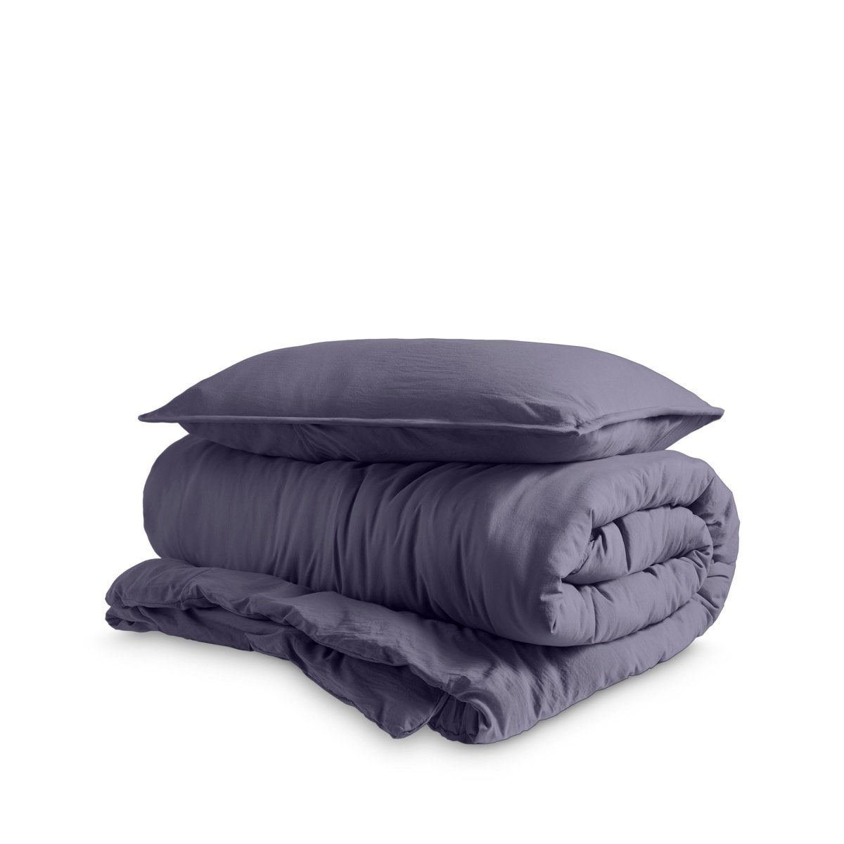 Washed duvet cover and sham set folded and stacked on a white background