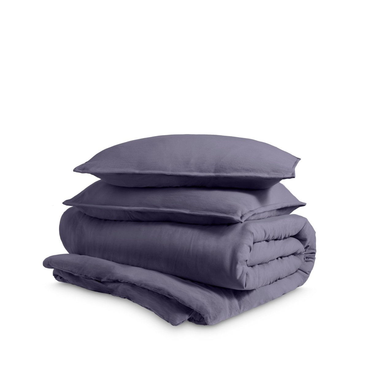 Washed duvet cover and sham set folded and stacked on a white background
